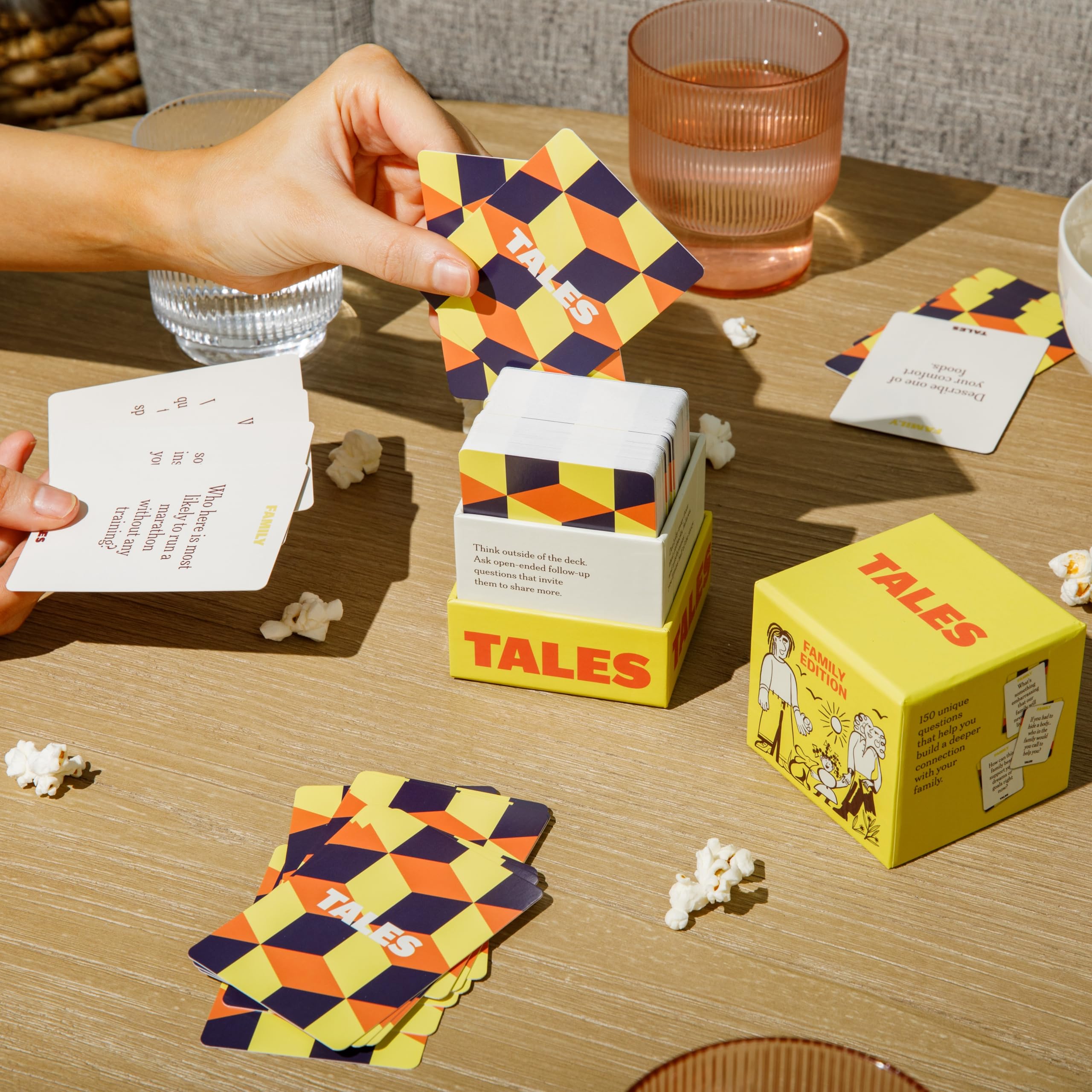 TALES deck next to smartphone to show compact size and convenience