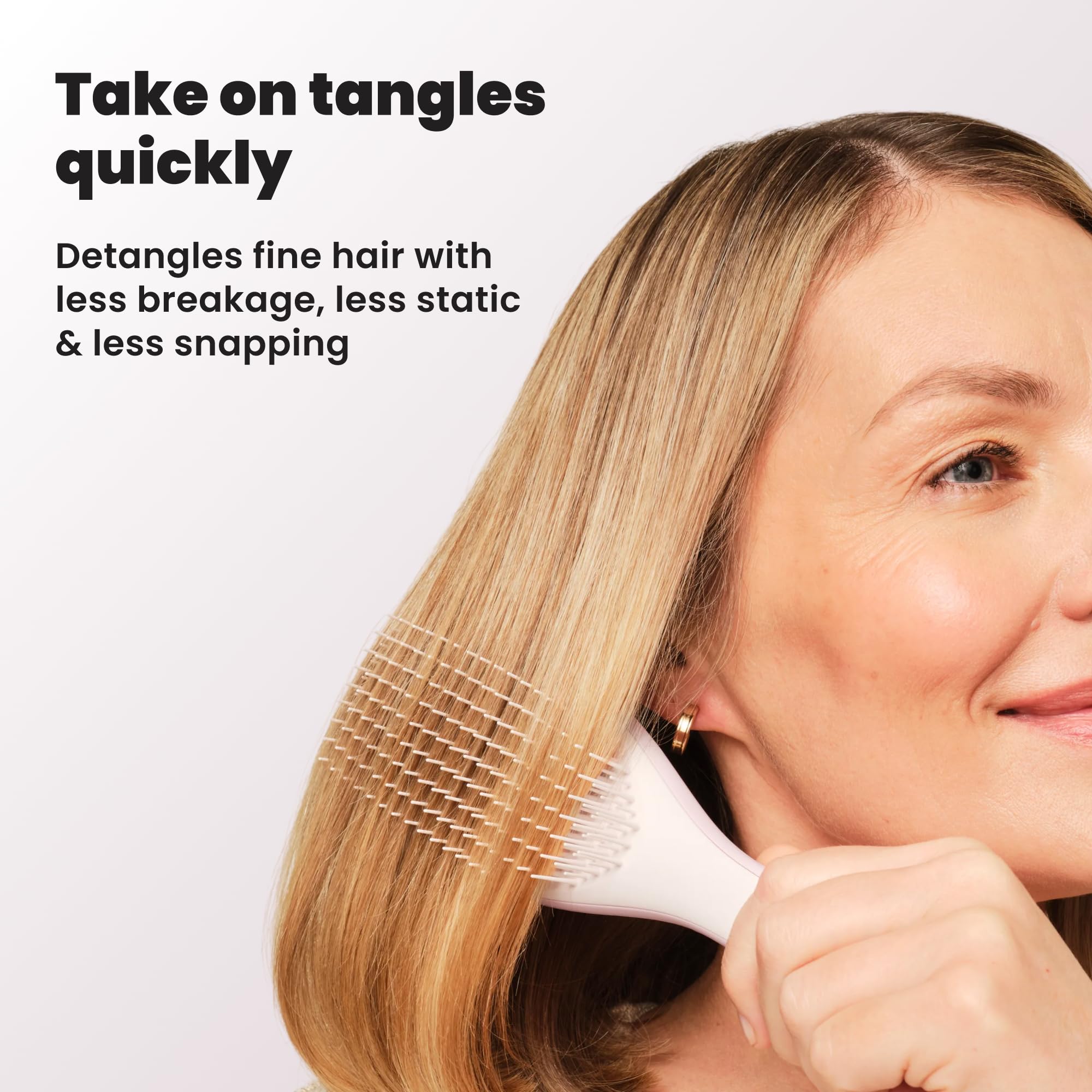TANGLE TEEZER tucked in a travel pouch, ideal for on-the-go touch-ups