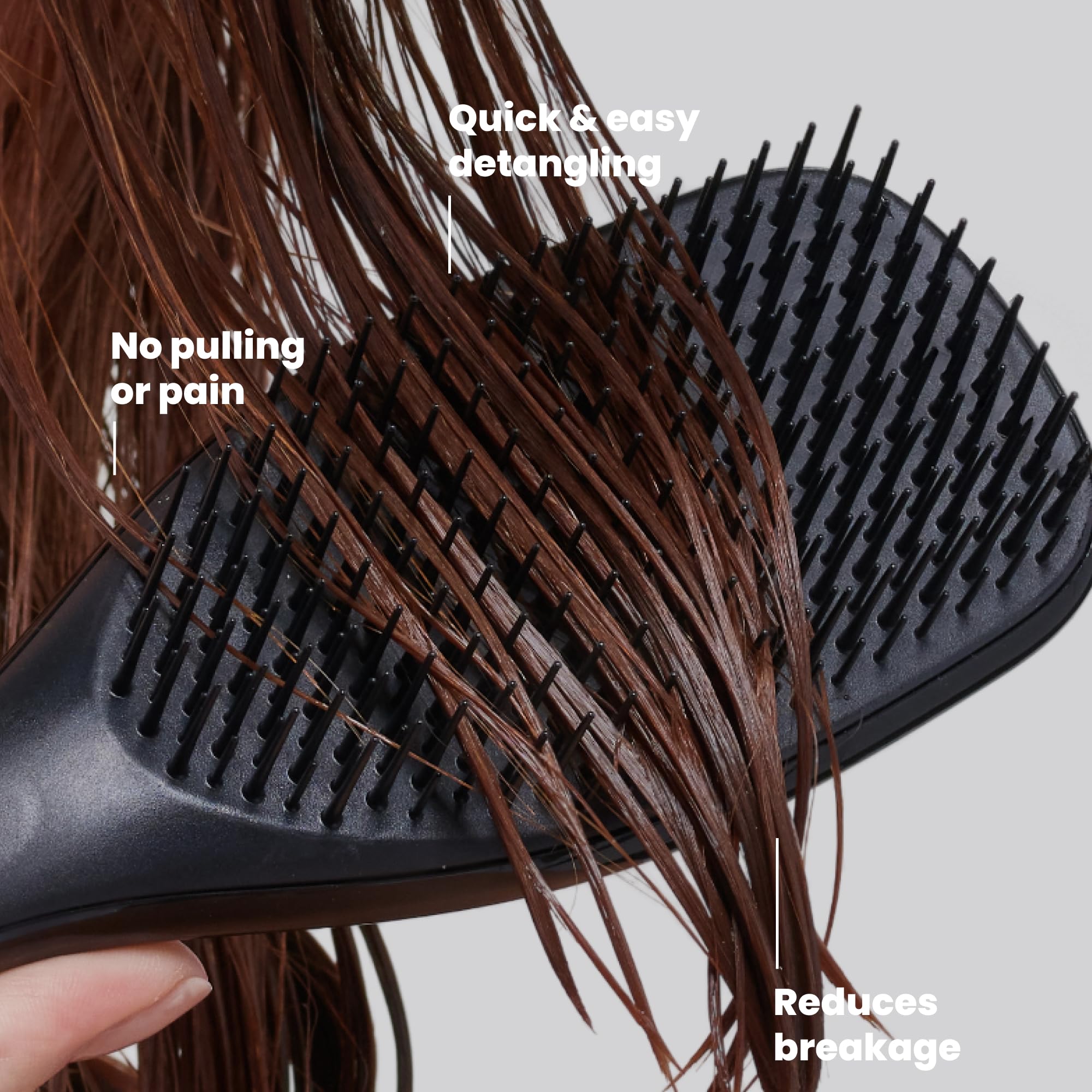 TANGLE TEEZER in hand detangling wet hair for smooth, less-damaging strokes