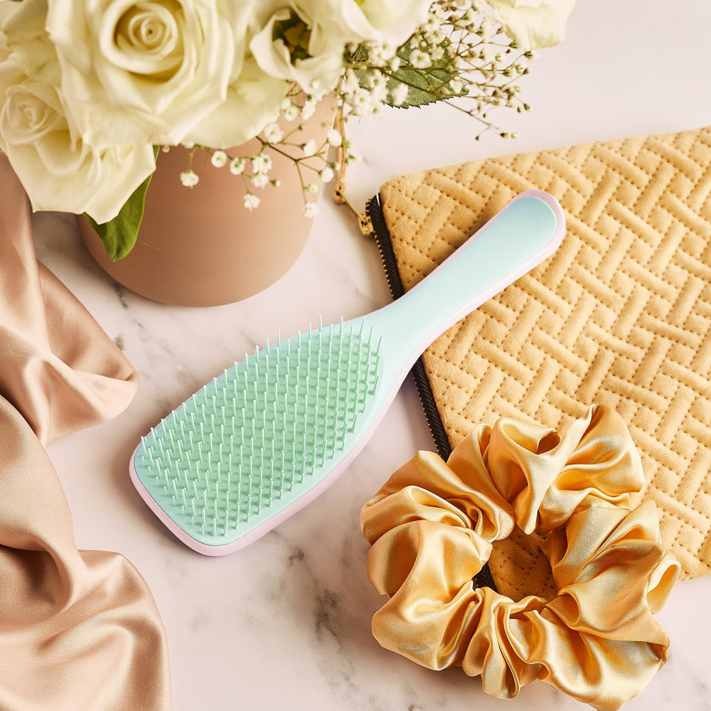 TANGLE TEEZER packed in travel bag showing portability and on-the-go styling benefit