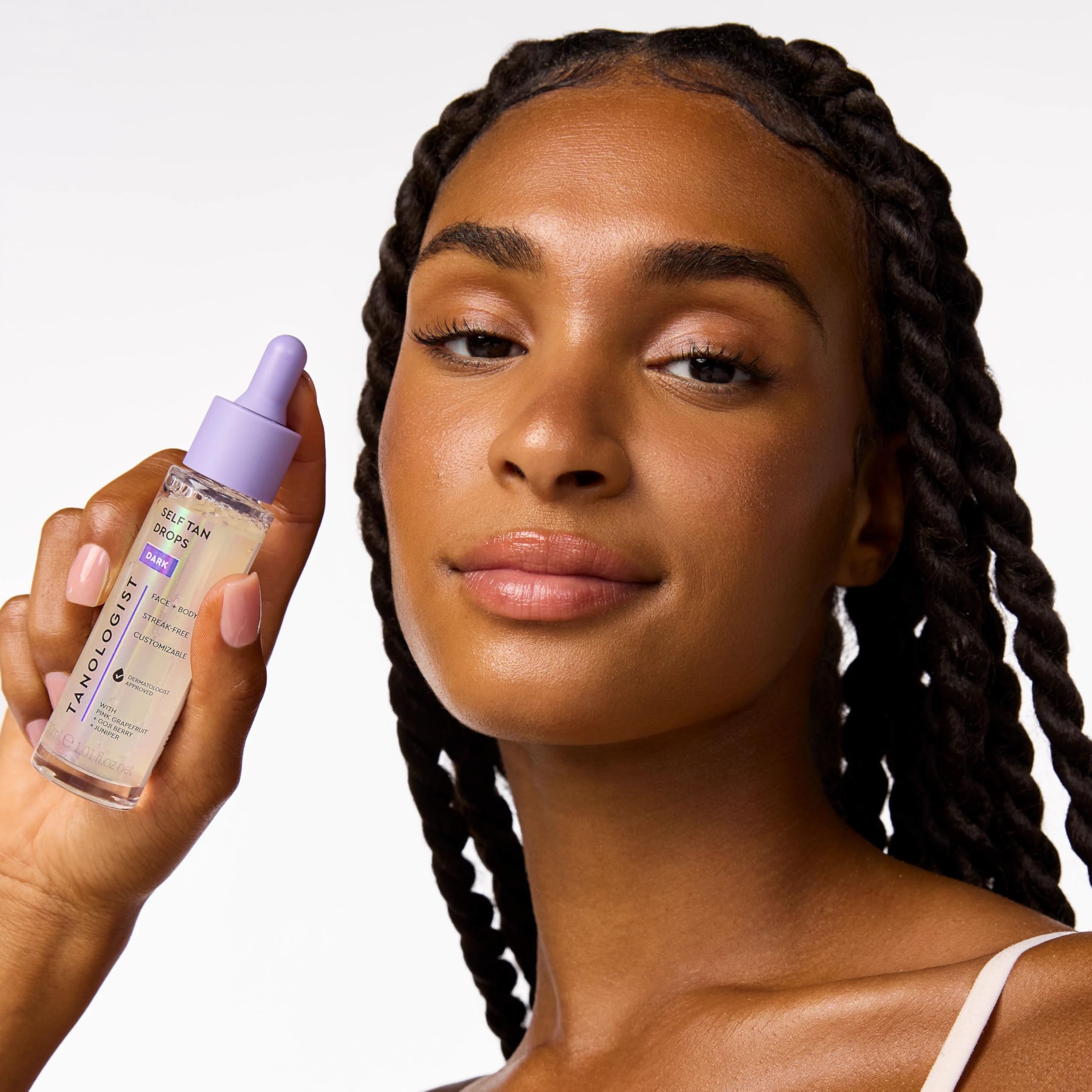Tanologist in a beach bag lifestyle shot for vacation-ready glow