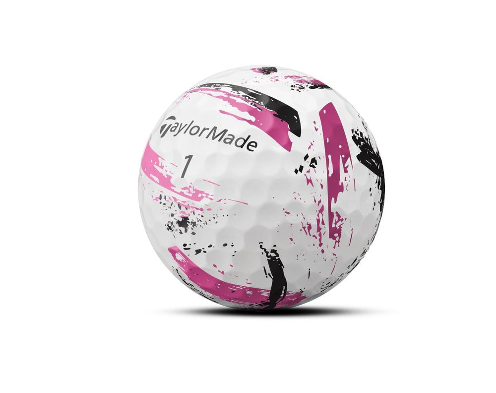 TaylorMade SPEEDSOFT Ink Pink ball mid-flight demonstrating visibility and tracking