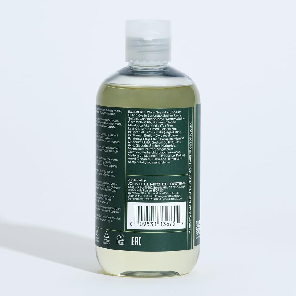 Tea Tree bottle staged on bathroom vanity with plants showing uplifting citrus-herbal scent and spa vibe