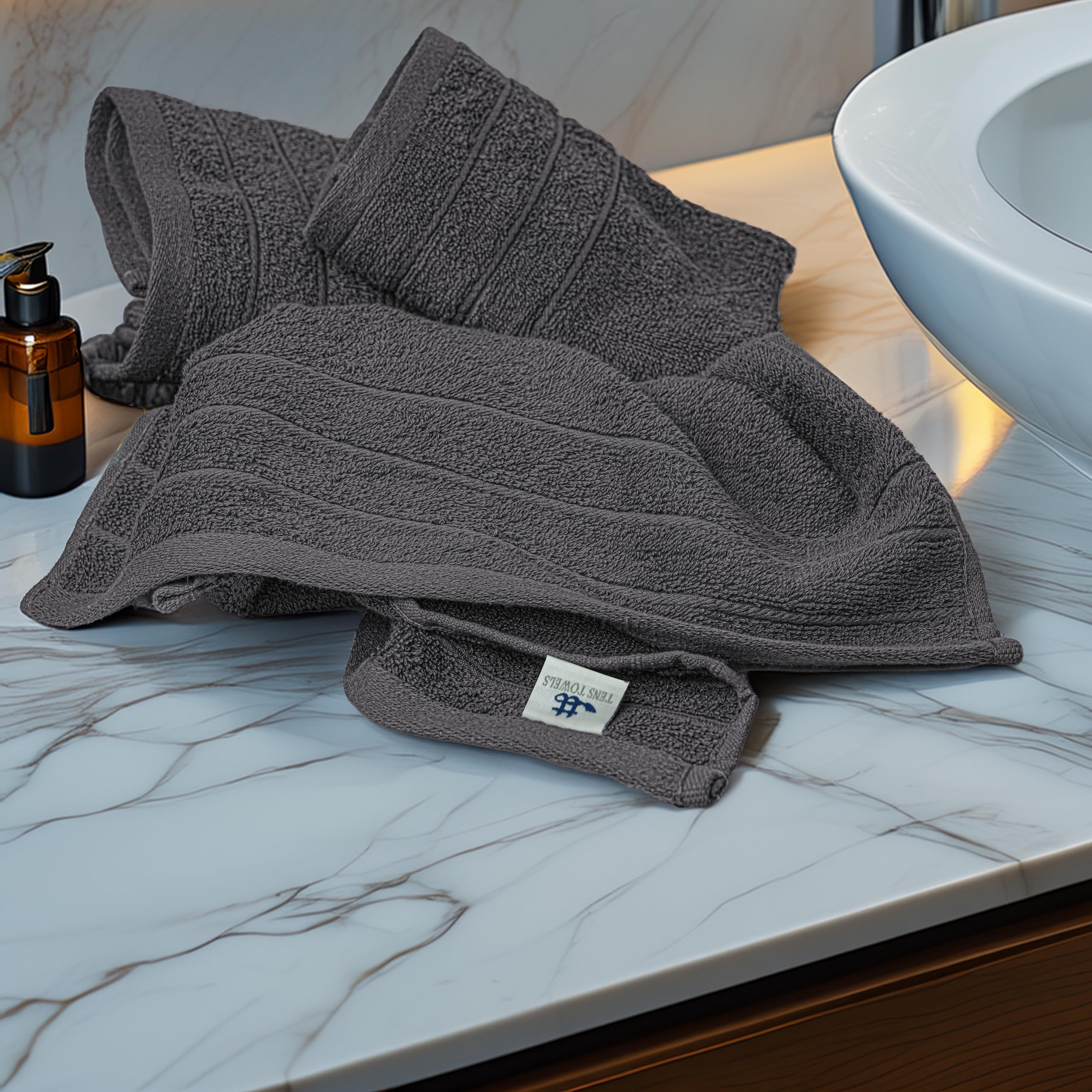Tens Towels folded stack on shelf demonstrating neat storage and coordinated look
