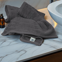 Tens Towels folded stack on shelf demonstrating neat storage and coordinated look