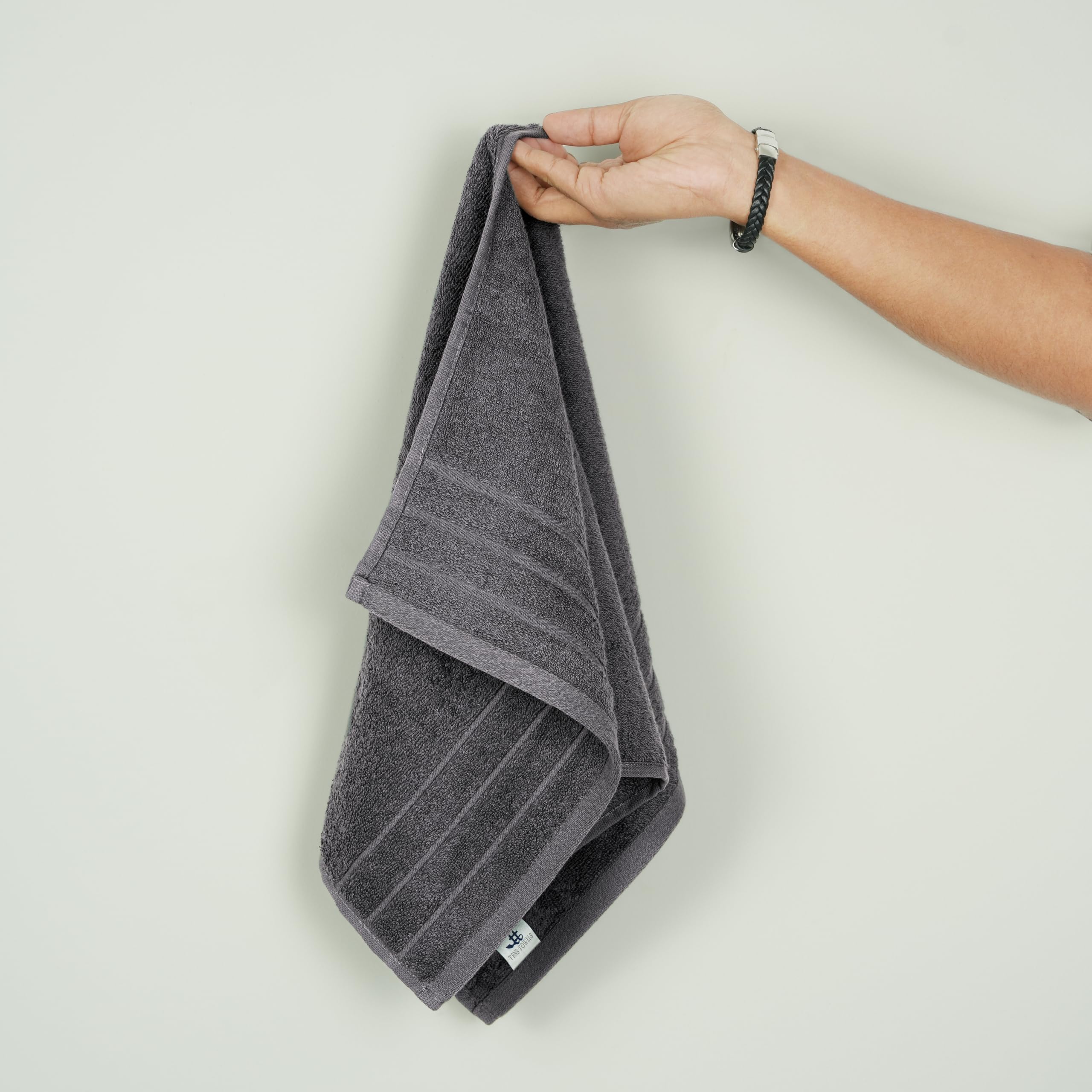 Tens Towels placed by kitchen sink showing multipurpose use and spill cleanup