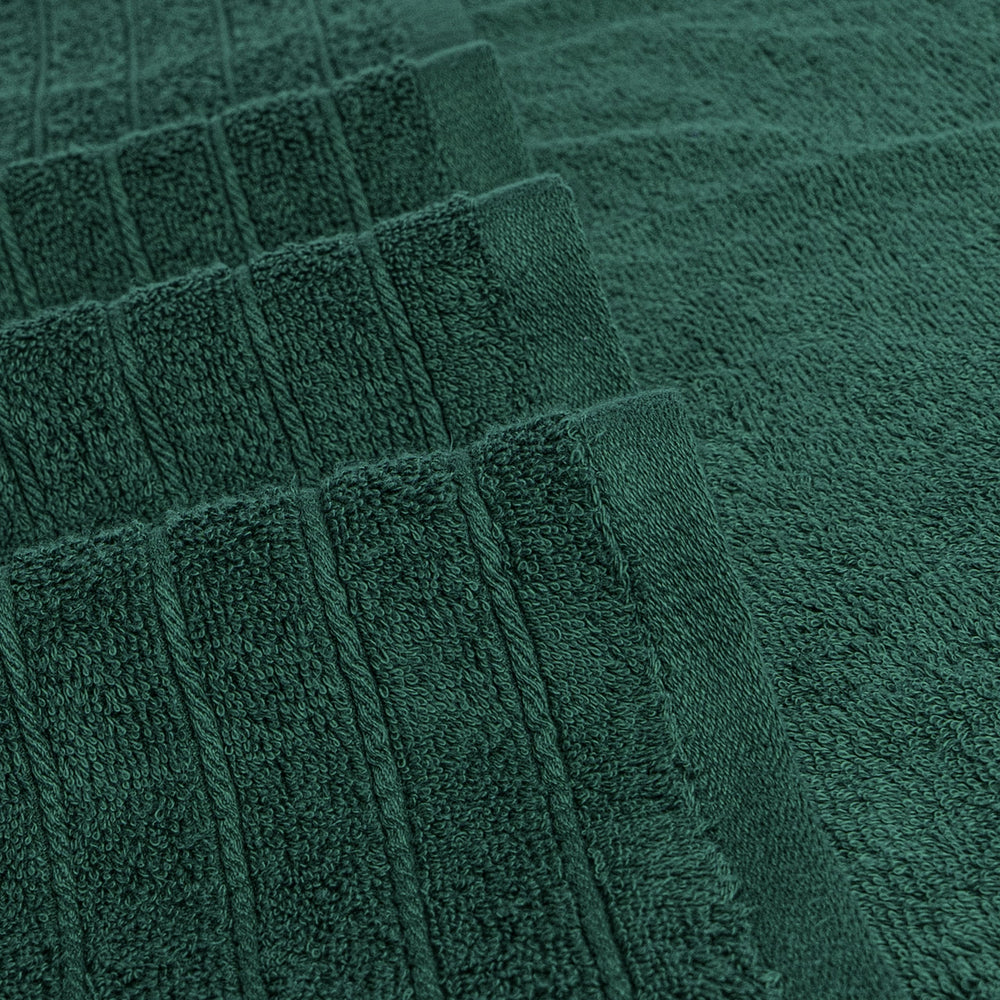 Tens Towels held by person to show 30x60 inch scale and full-body coverage benefit