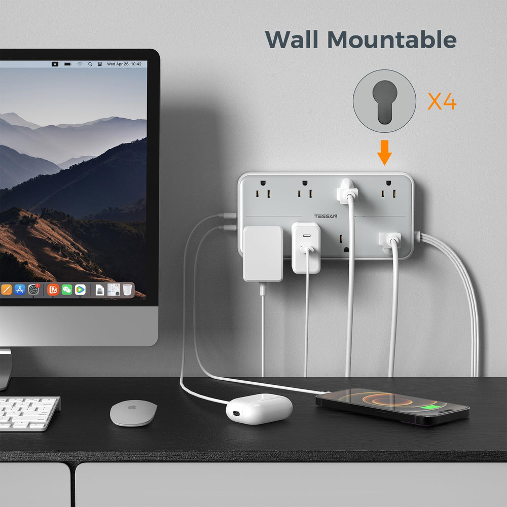 TESSAN on a desk charging laptop and phone to organize workspace power needs