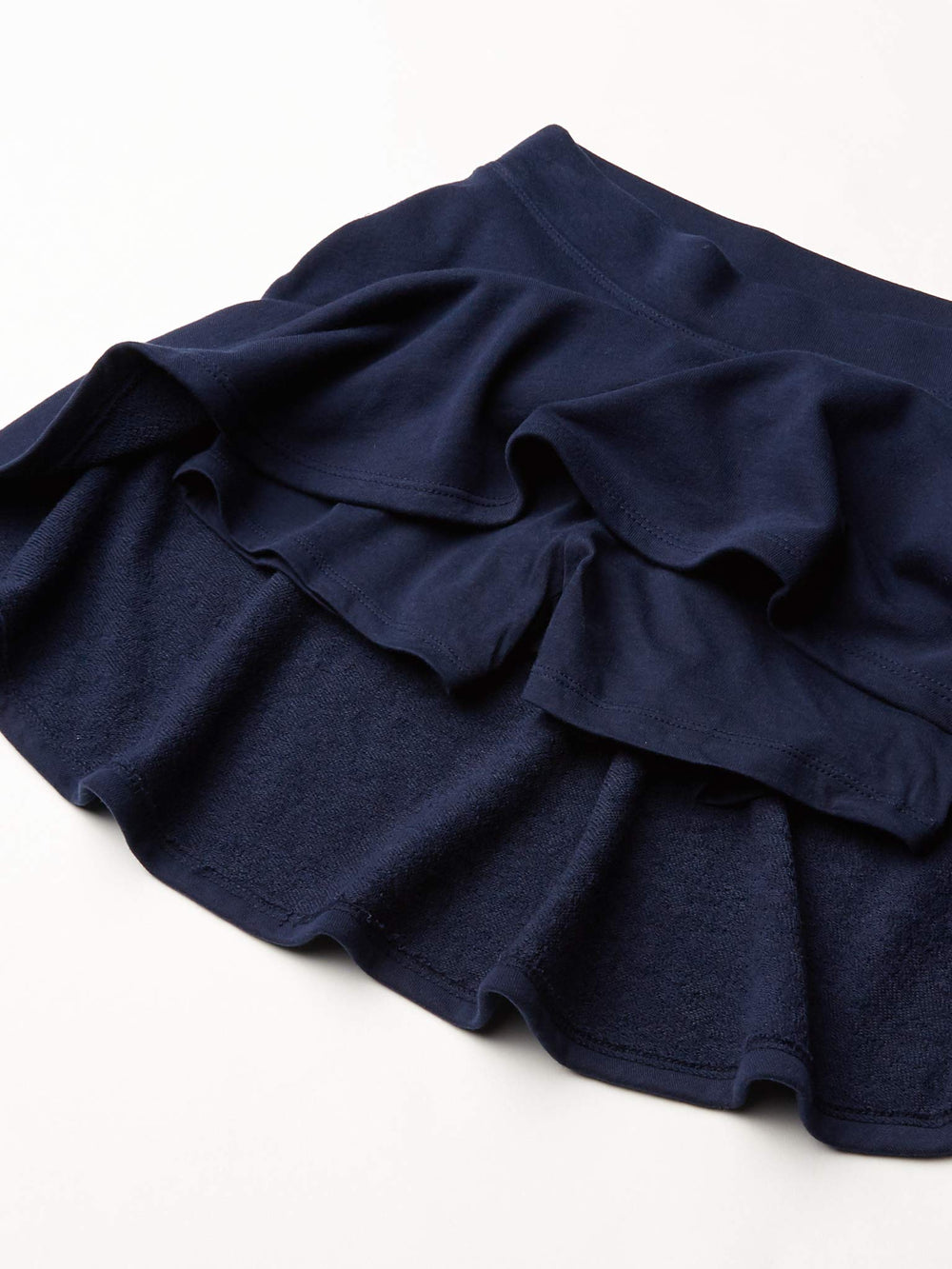 The Children's Place girl wearing skort running shows coverage and movement freedom