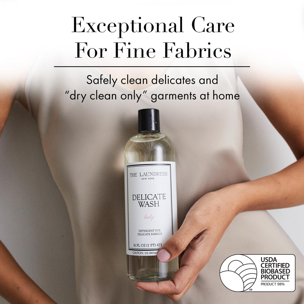 Close-up of The Laundress label highlighting fragrance notes and instructions