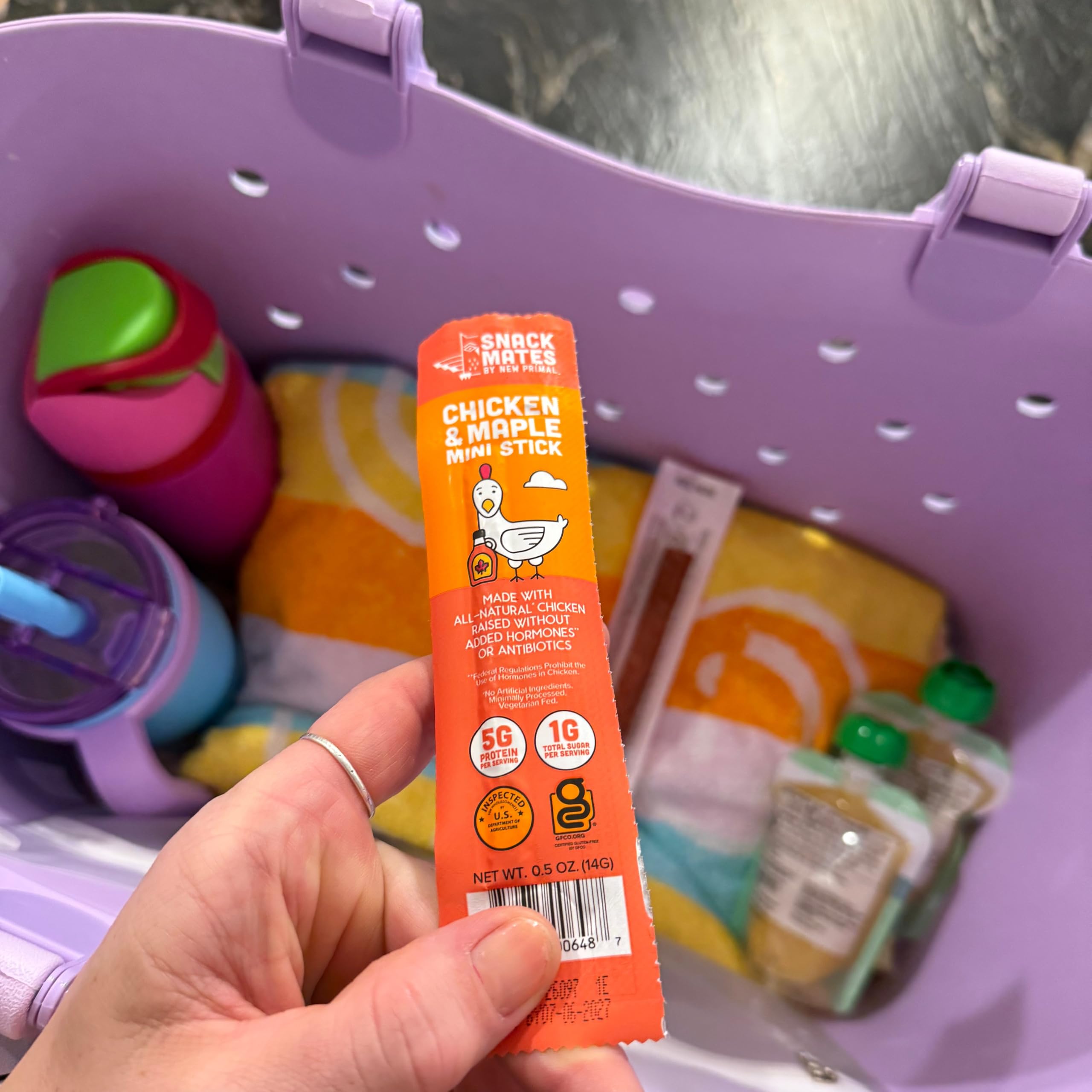 the new primal stick held in hand to show portable snack size
