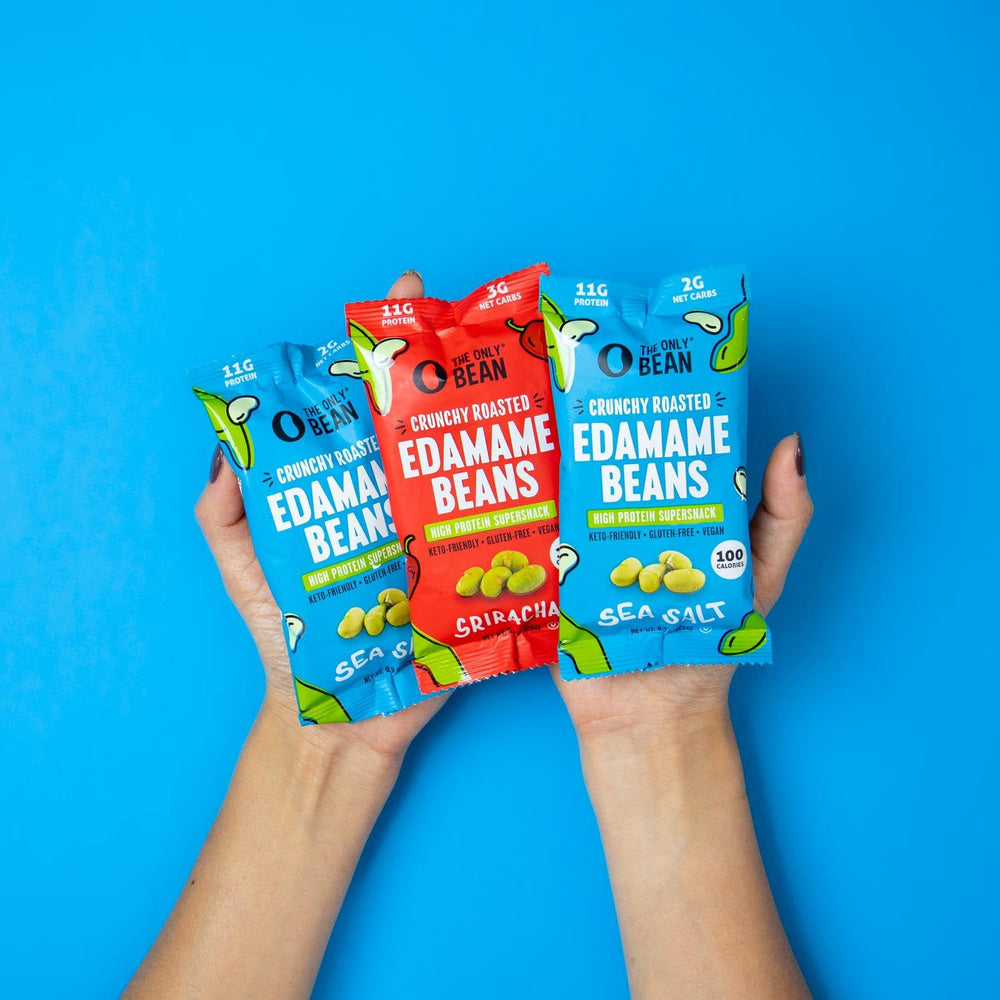 The Only Bean pack next to smartphone demonstrating small portable size