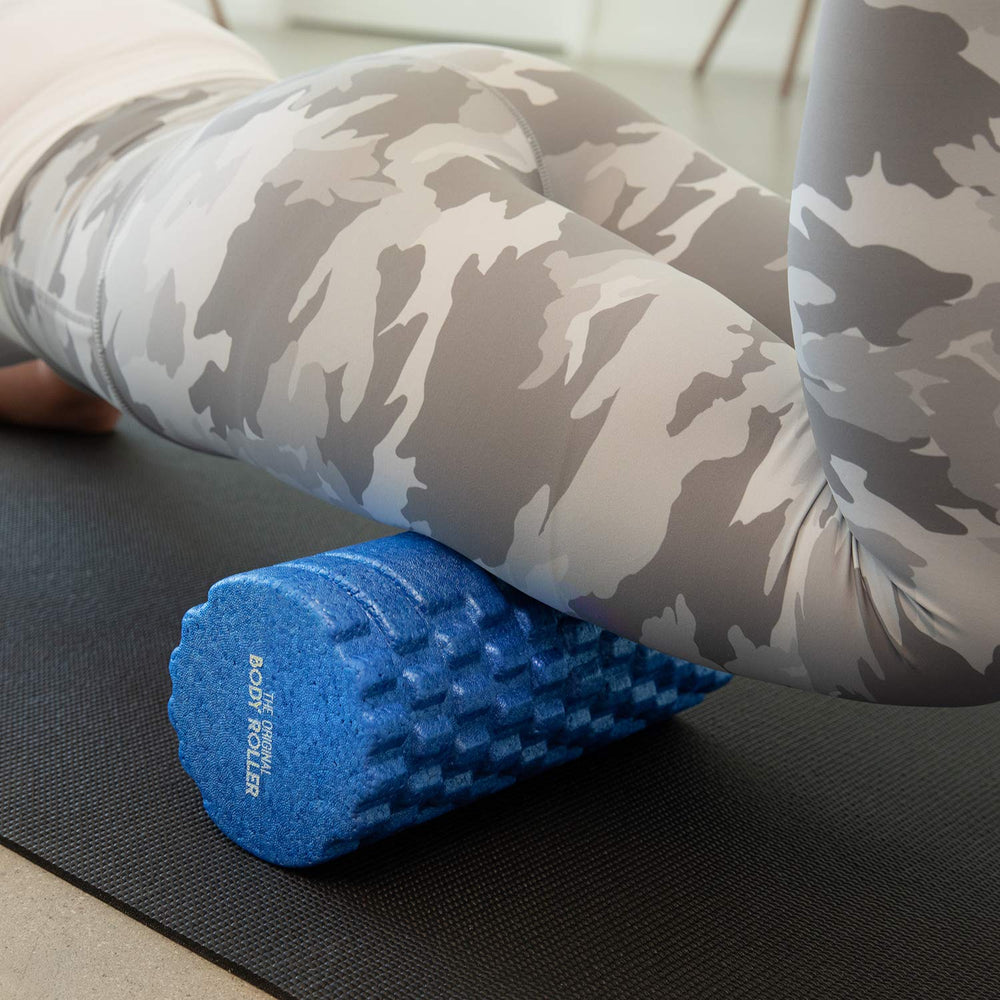 The Original Body Roller on exercise mat in home gym setting showing convenient use benefit