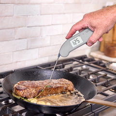 ThermoWorks Thermapen ONE in use on a grill for accurate temperature checks