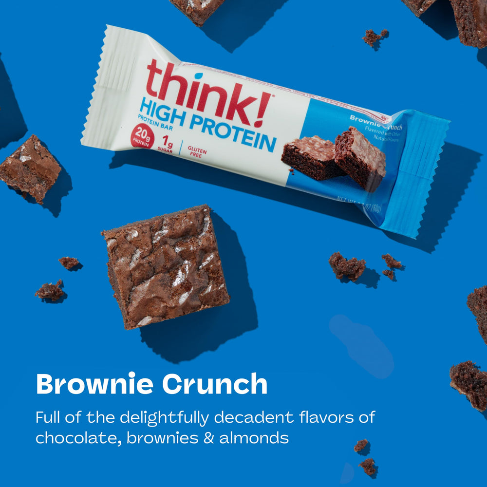 thinkThin unwrapped Brownie Crunch bar close-up showing chocolate coating and interior benefit