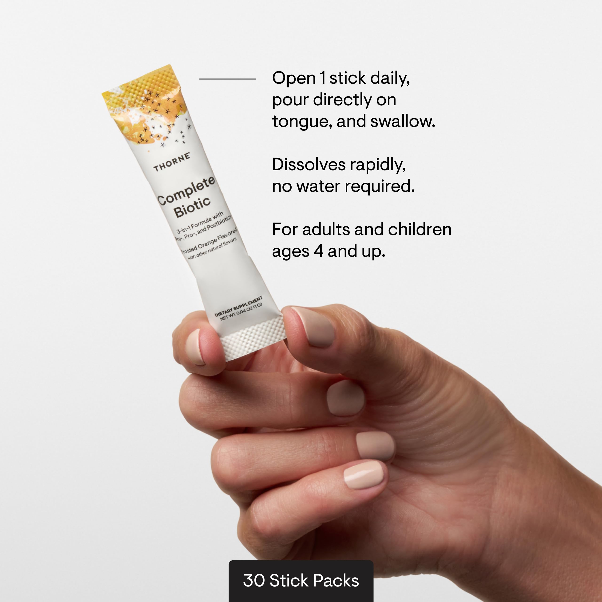 THORNE stick pack beside a teaspoon showing compact serving size