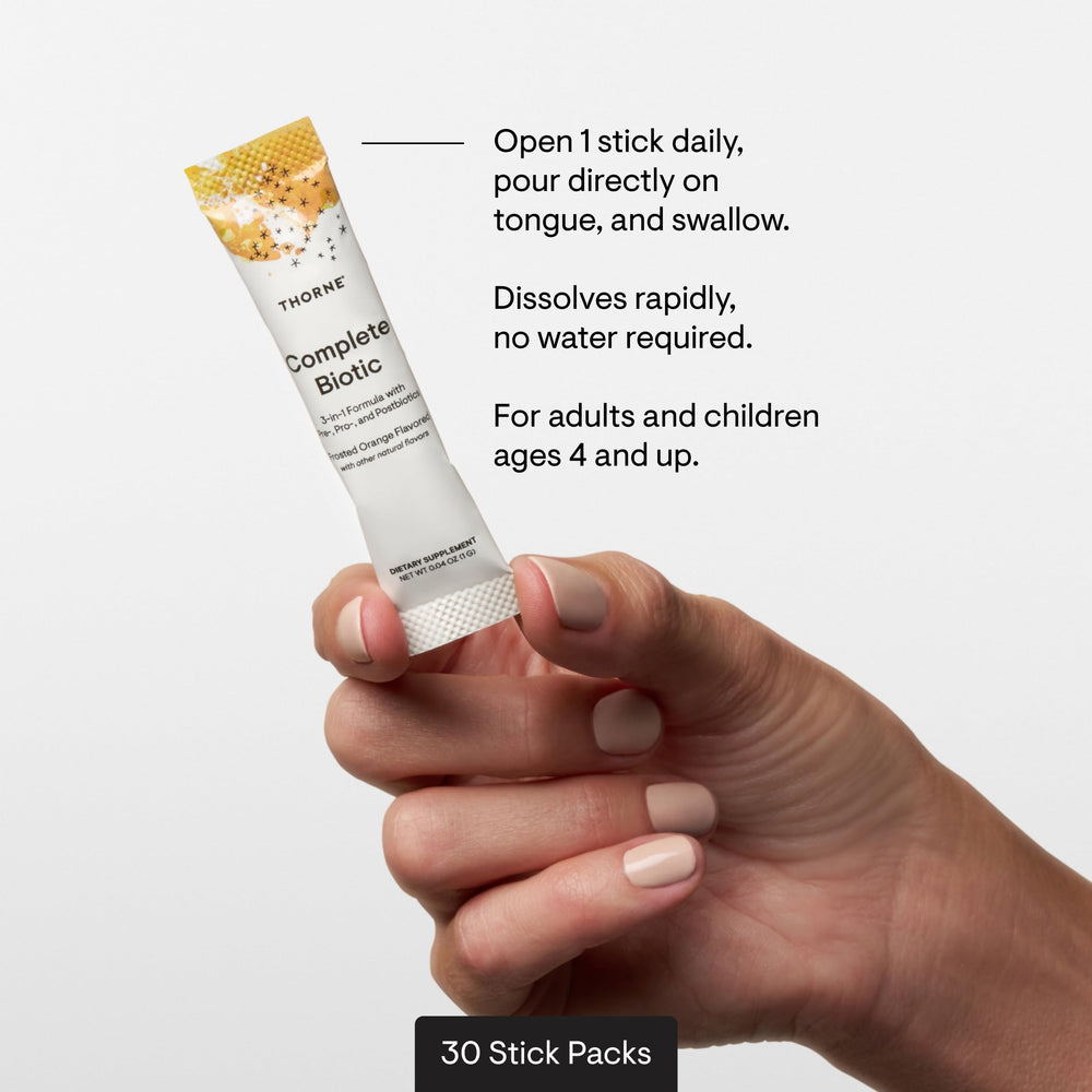 THORNE stick pack beside a teaspoon showing compact serving size