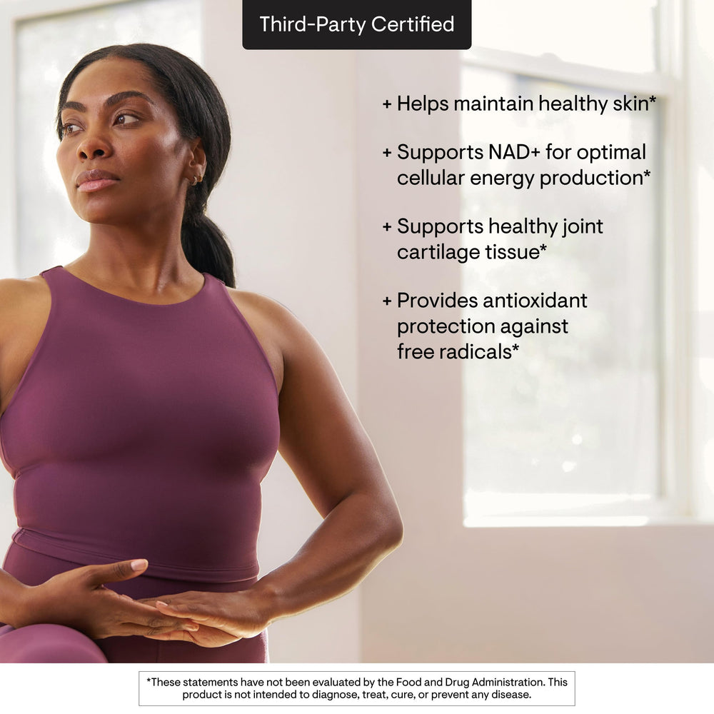 THORNE capsules in hand for scale and simple daily dosing benefit