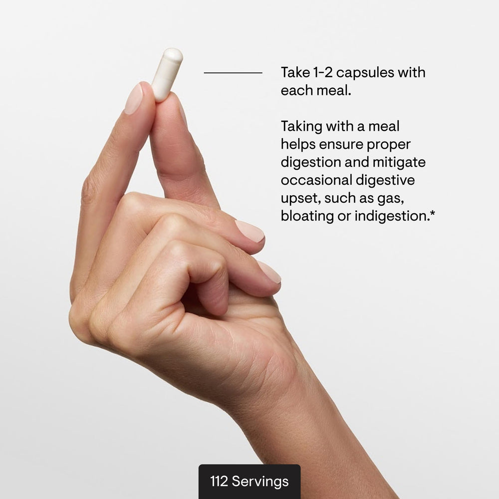 THORNE capsules in hand for scale to show capsule size and dosage