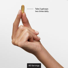THORNE softgel in hand for scale demonstrating compact easy-to-swallow size