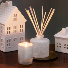 Thymes Frasier Fir pouring fragrance oil into bottle demonstrates easy, flameless setup