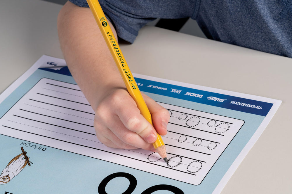 Ticonderoga pencil held in a child’s hand showing improved handwriting control benefit