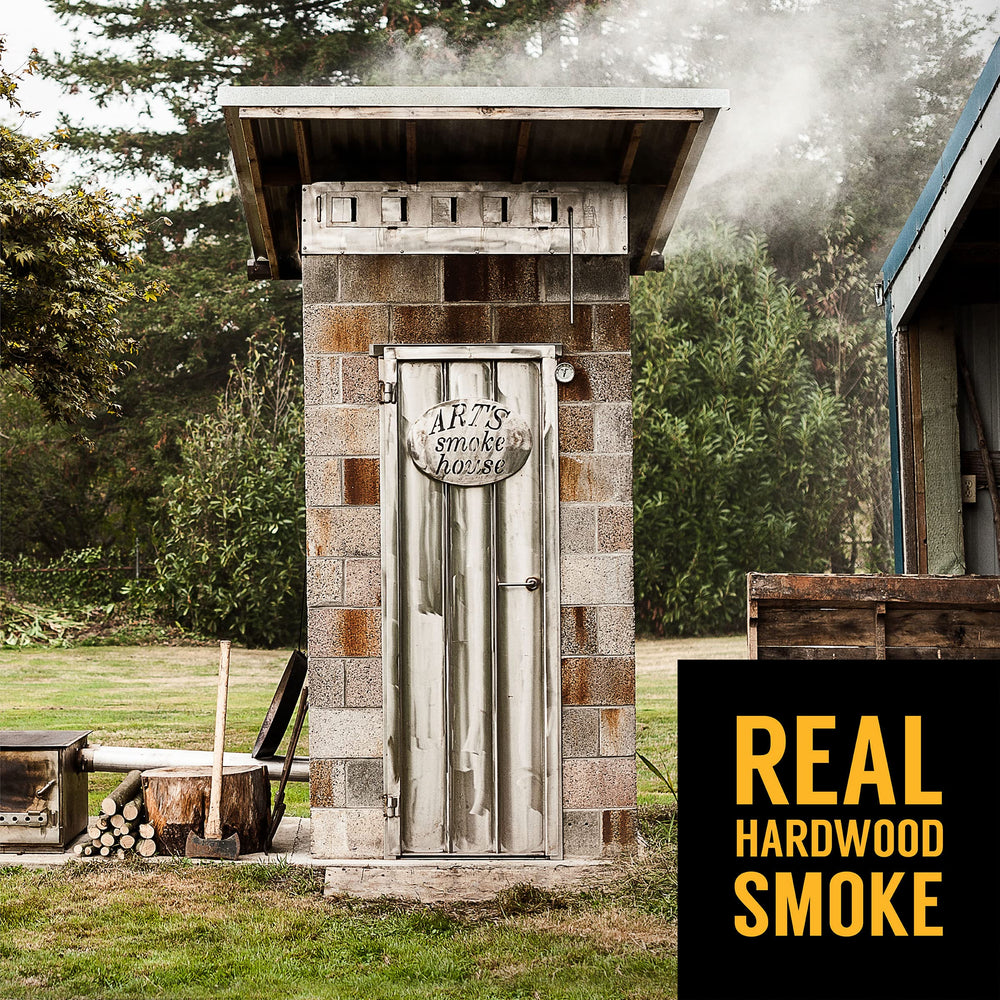 Tillamook Country Smoker stick held in hand for scale showing convenient snack size benefit