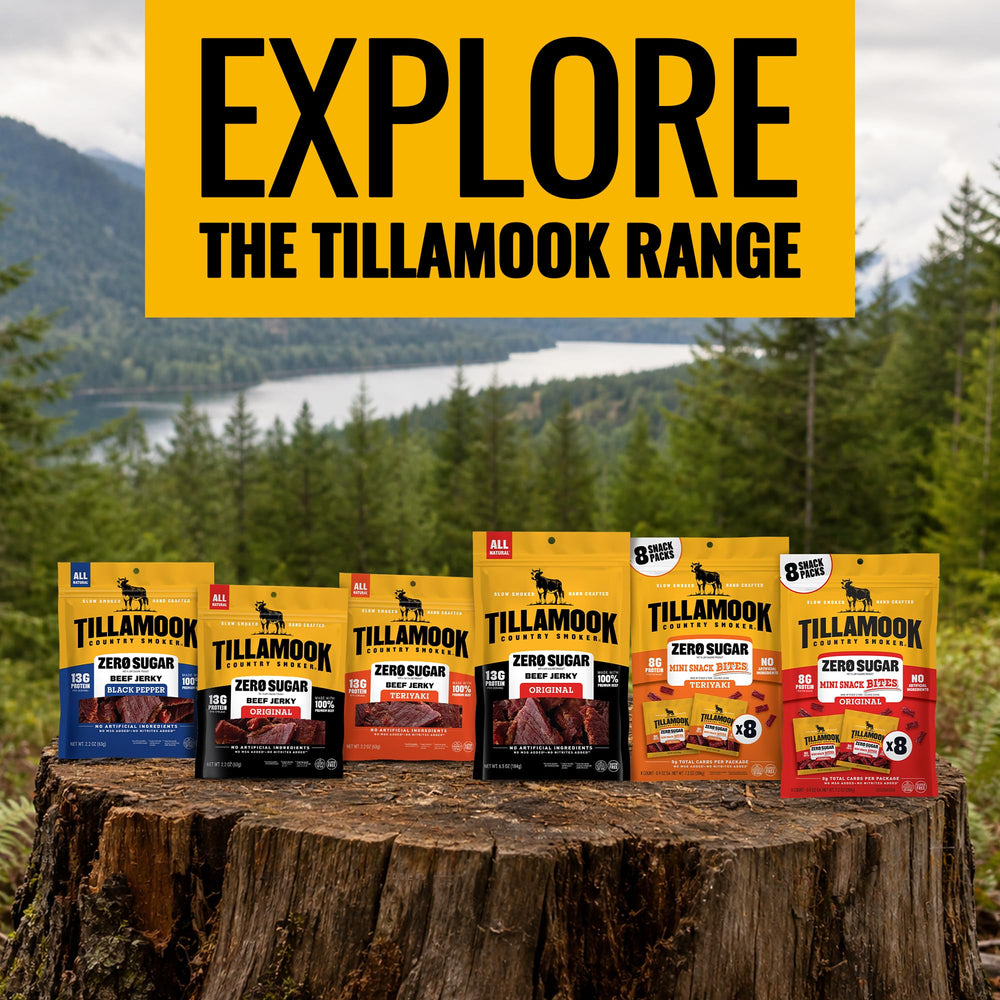 Tillamook Country Smoker sticks on smoked wood background emphasizing real hardwood smoke