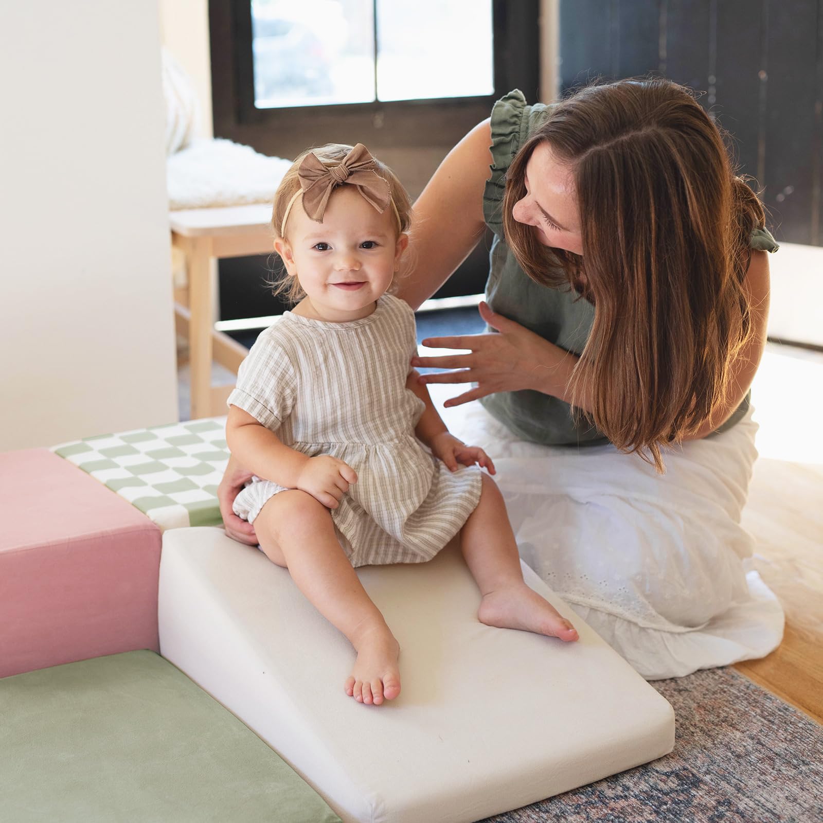 Tiny Land size comparison beside stuffed toy, demonstrates compact, child-scaled dimensions