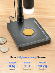 TOMLOV display lit showing a coin magnified for clear assessment