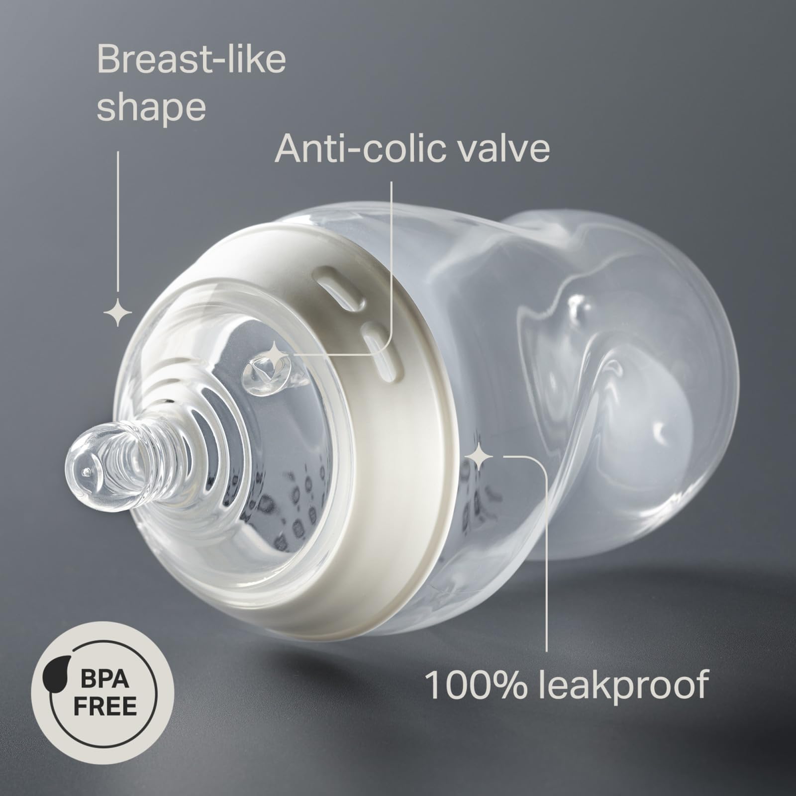 Tommee Tippee bottle held in adult hand for real size and scale benefit