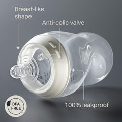 Tommee Tippee bottle held in adult hand for real size and scale benefit