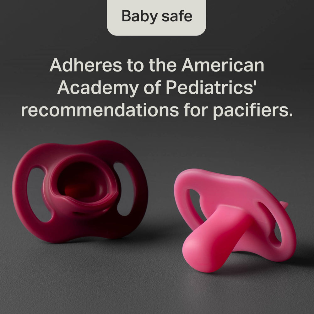 Tommee Tippee pacifier in adult hand to show size and infant-friendly scale
