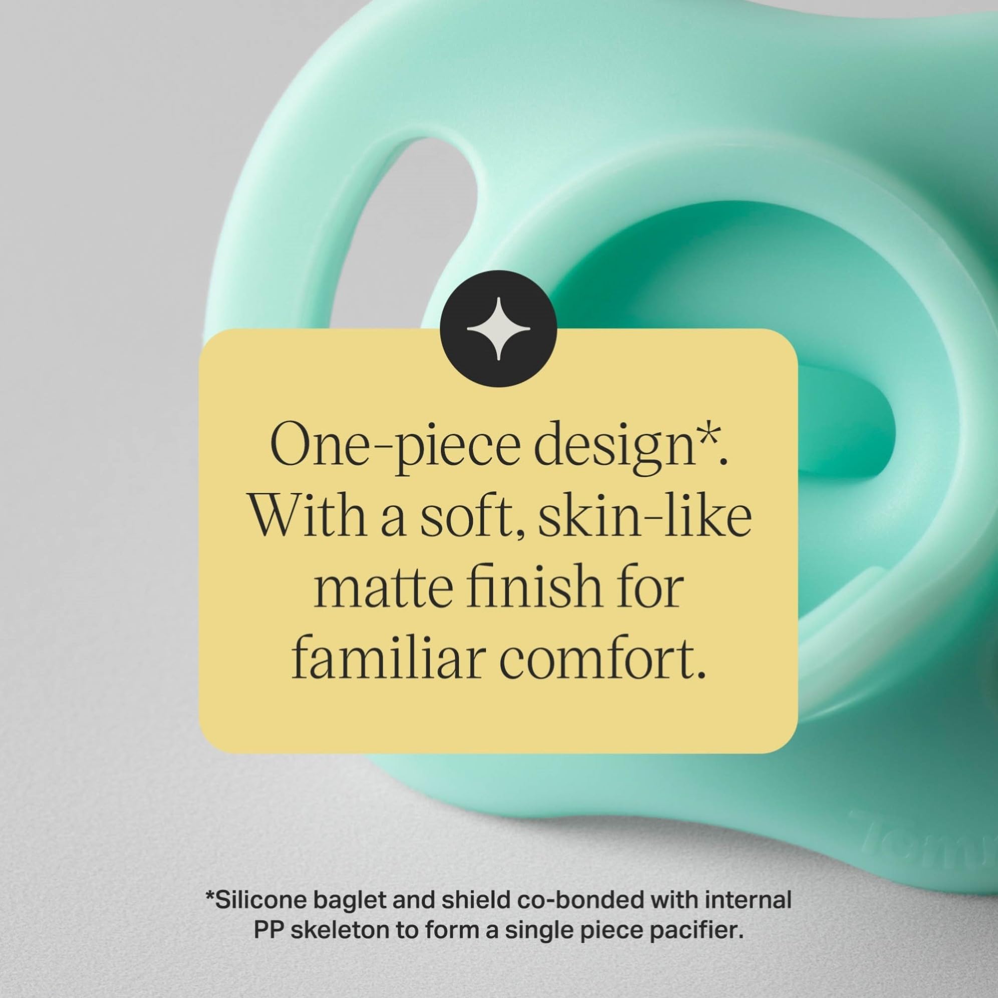 Tommee Tippee pacifier beside bottle cap for clear size and scale comparison