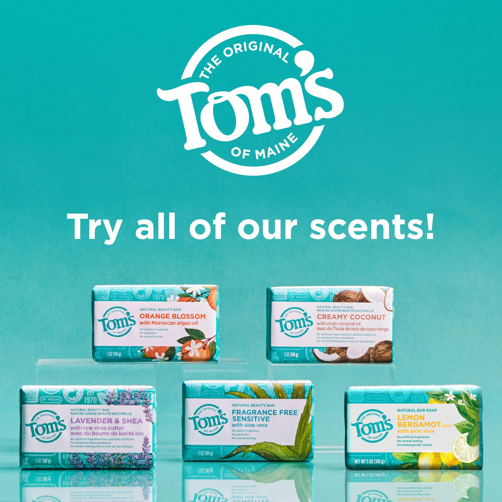 Tom's of Maine bar held in hand to show 5 oz size and portability benefit