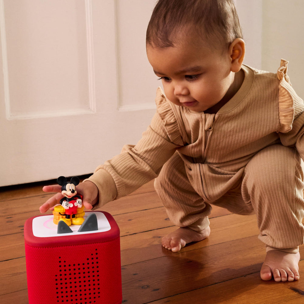 Tonies Mickey Mouse placed on Toniebox playing audio for instant screen-free entertainment benefit