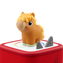 Tonies cow figure close-up showing soft texture and safe toddler grip benefit