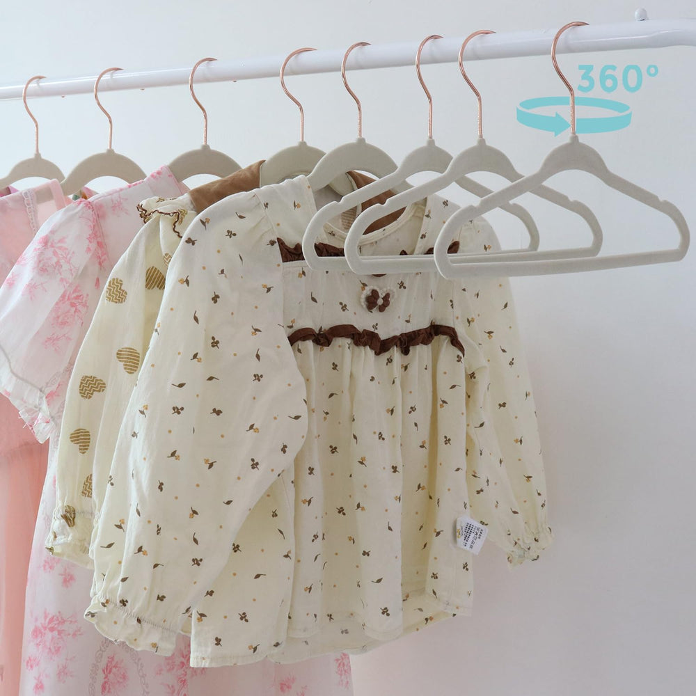 Tonswachic hanger beside baby outfit showing 11-inch size fit