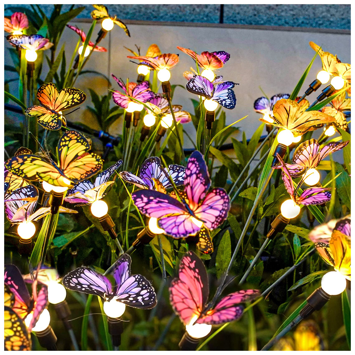 tonulax front view of two butterfly stakes showing decorative garden lighting benefit