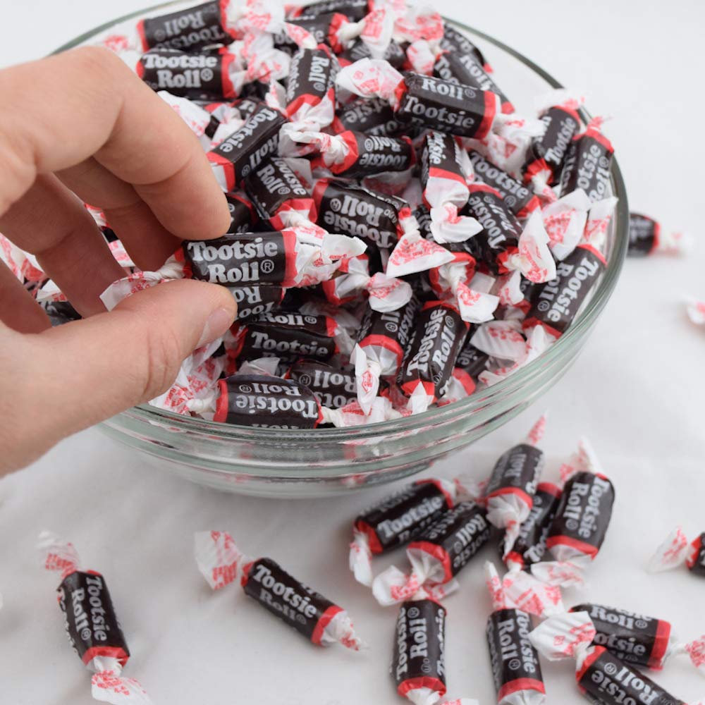 Hand holding a Tootsie Roll Midgee to show size and portion control