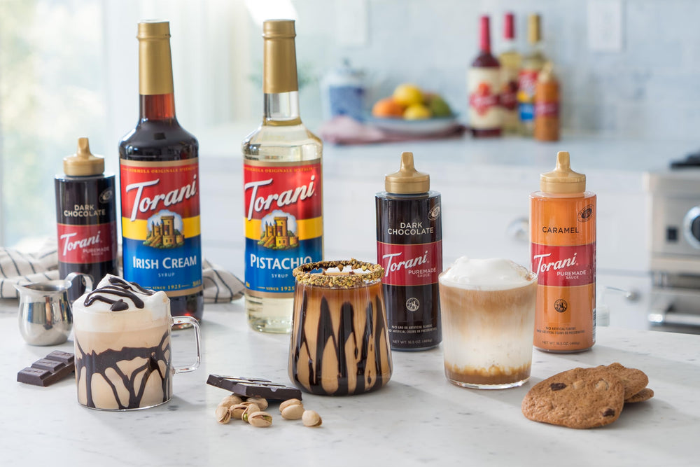 Torani Puremade dark chocolate next to a measuring cup and glass for portion and scale clarity