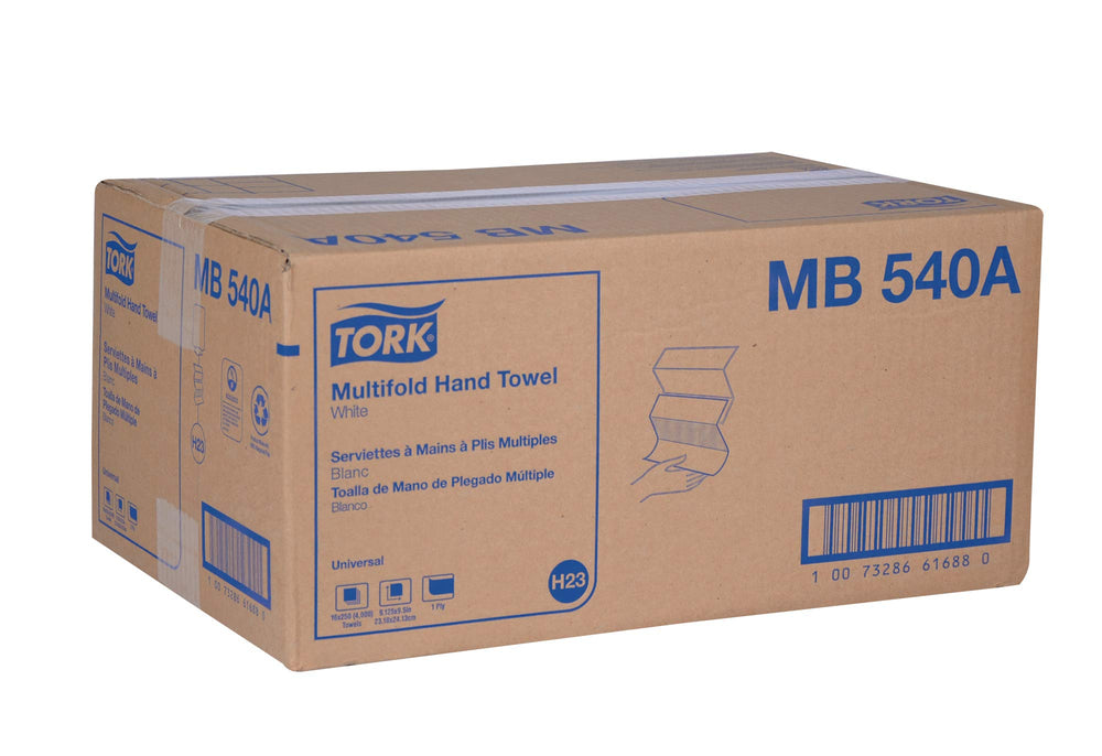 tork towel next to common items to show folded size and dispenser fit