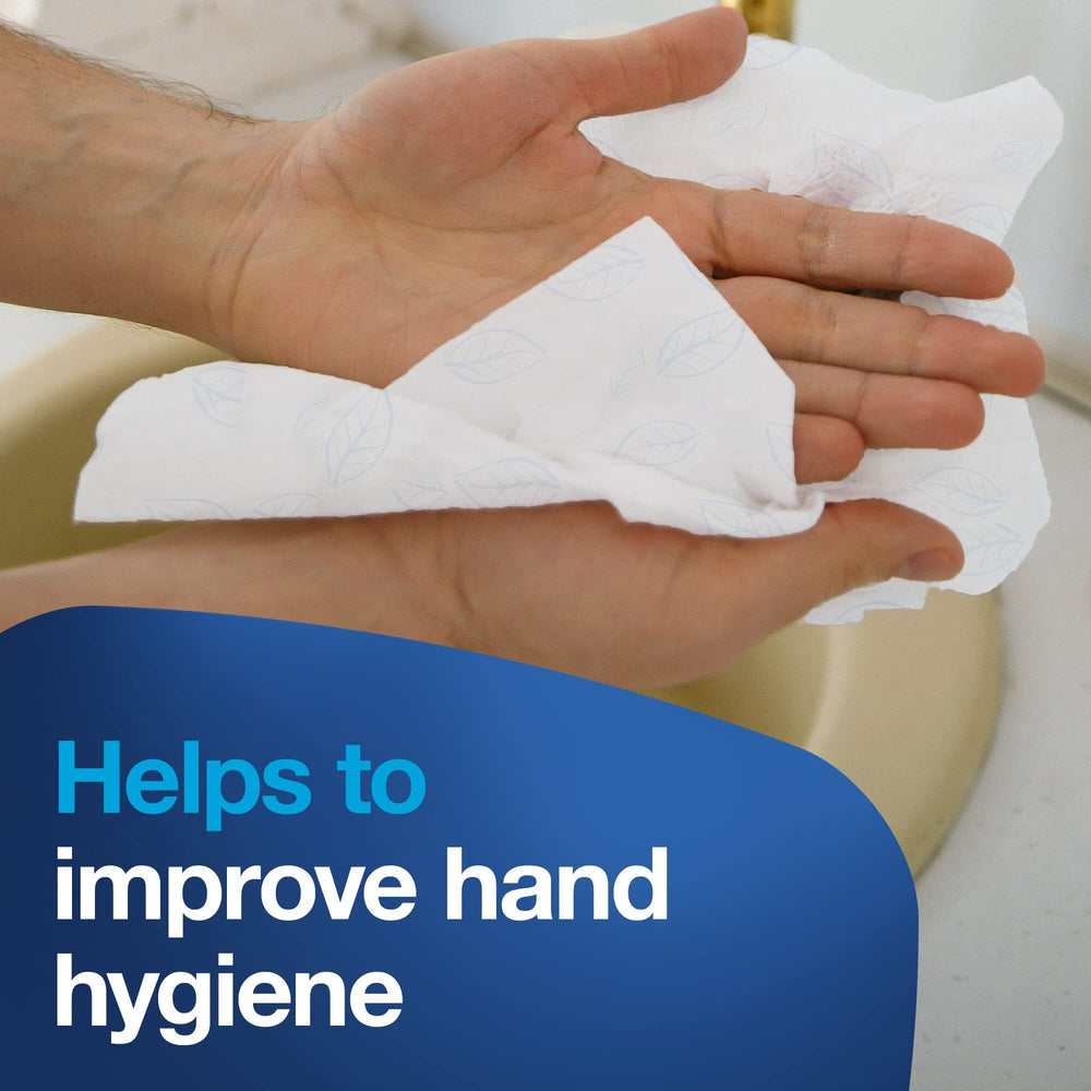 Unfolded Tork hand towel laying flat showing full surface absorbency for efficient drying