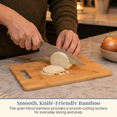 Totally Bamboo large board in use carving bread with roomy surface benefit