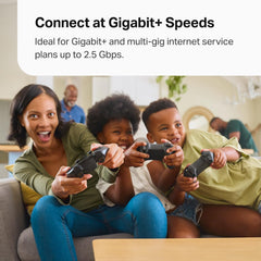 TP‑Link Deco XE70 Pro unit placed in living room improving whole‑home Wi‑Fi coverage
