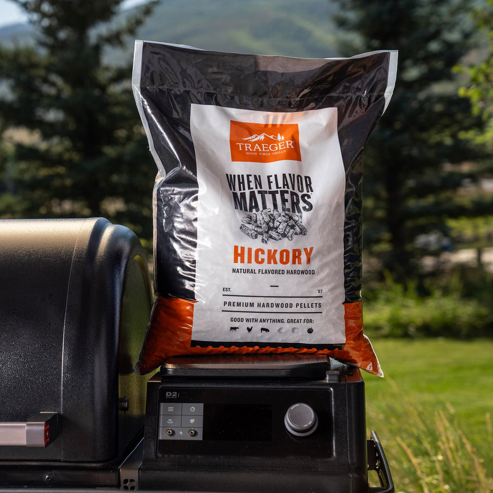 Plate of smoked brisket and vegetables flavored with Traeger hickory pellets
