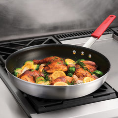 Tramontina fry pan side profile highlighting heavy-gauge aluminum for even heating