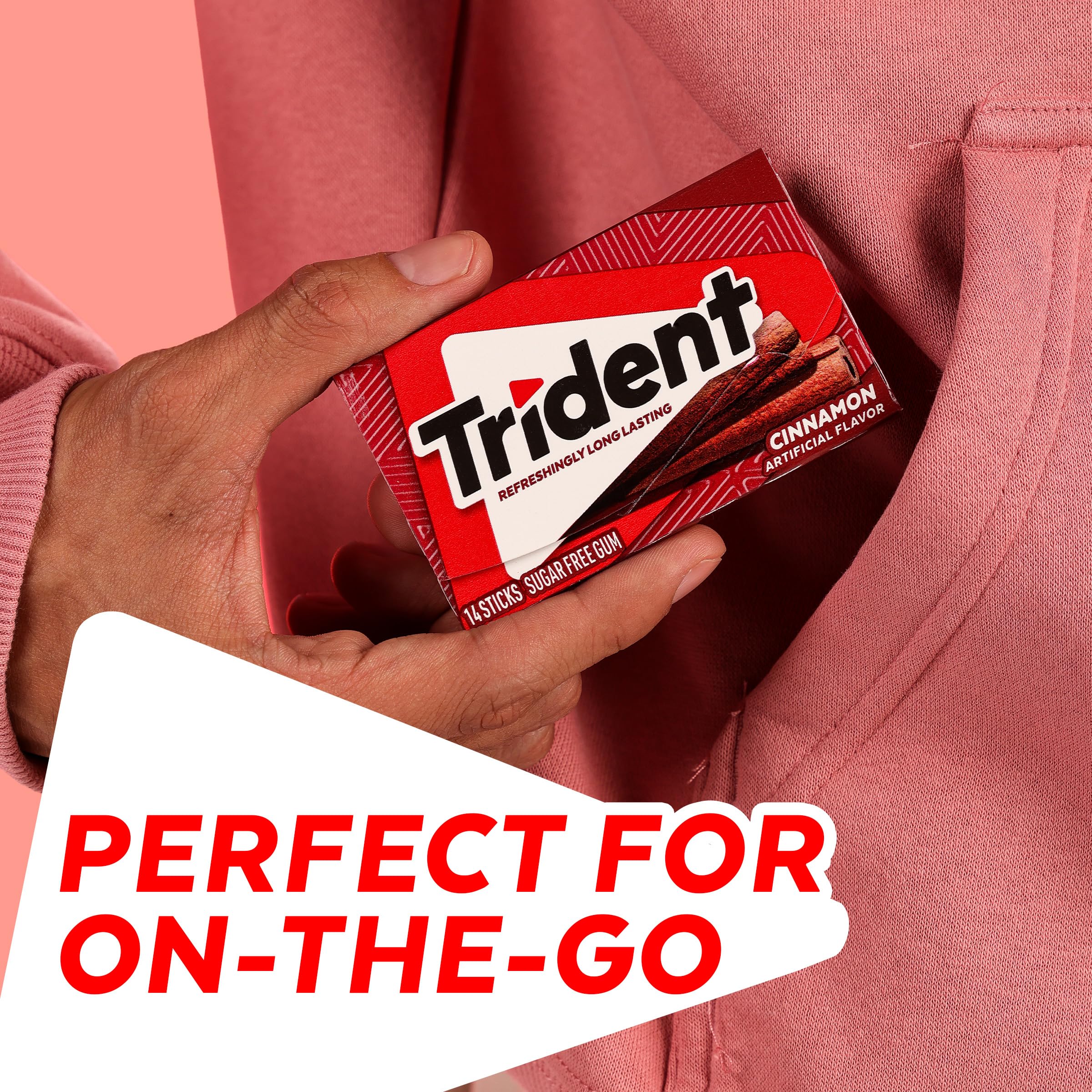 Person chewing Trident cinnamon stick showing fresh flavor enjoyment