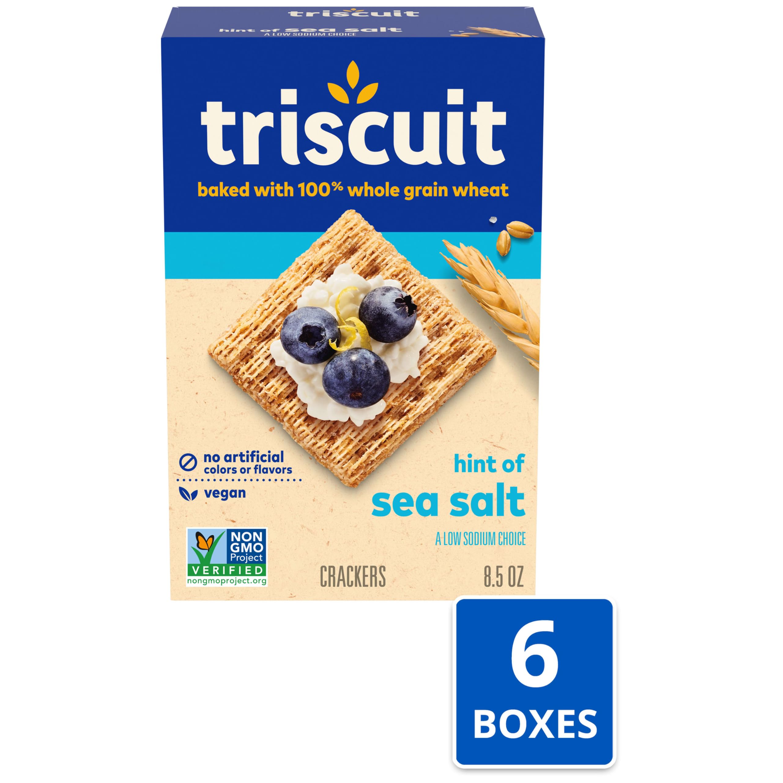 Triscuit cracker topped with goat cheese showing topping support