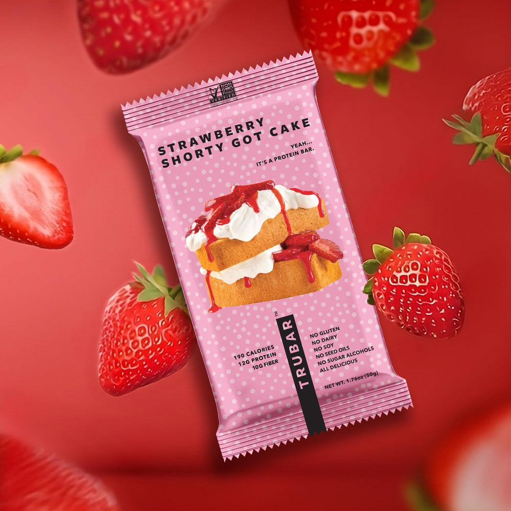 TRUBAR bar enjoyed outdoors on a bench for on-the-go nourishment and taste satisfaction